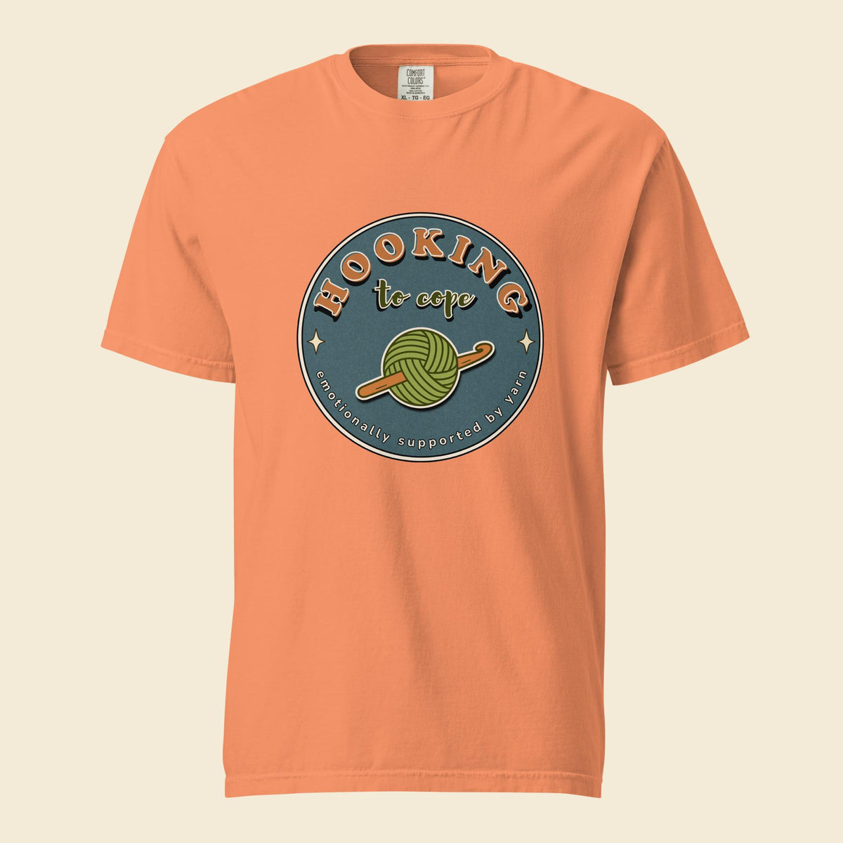 Terracotta heavyweight T-shirt with Hooking to Cope crochet badge artwork
