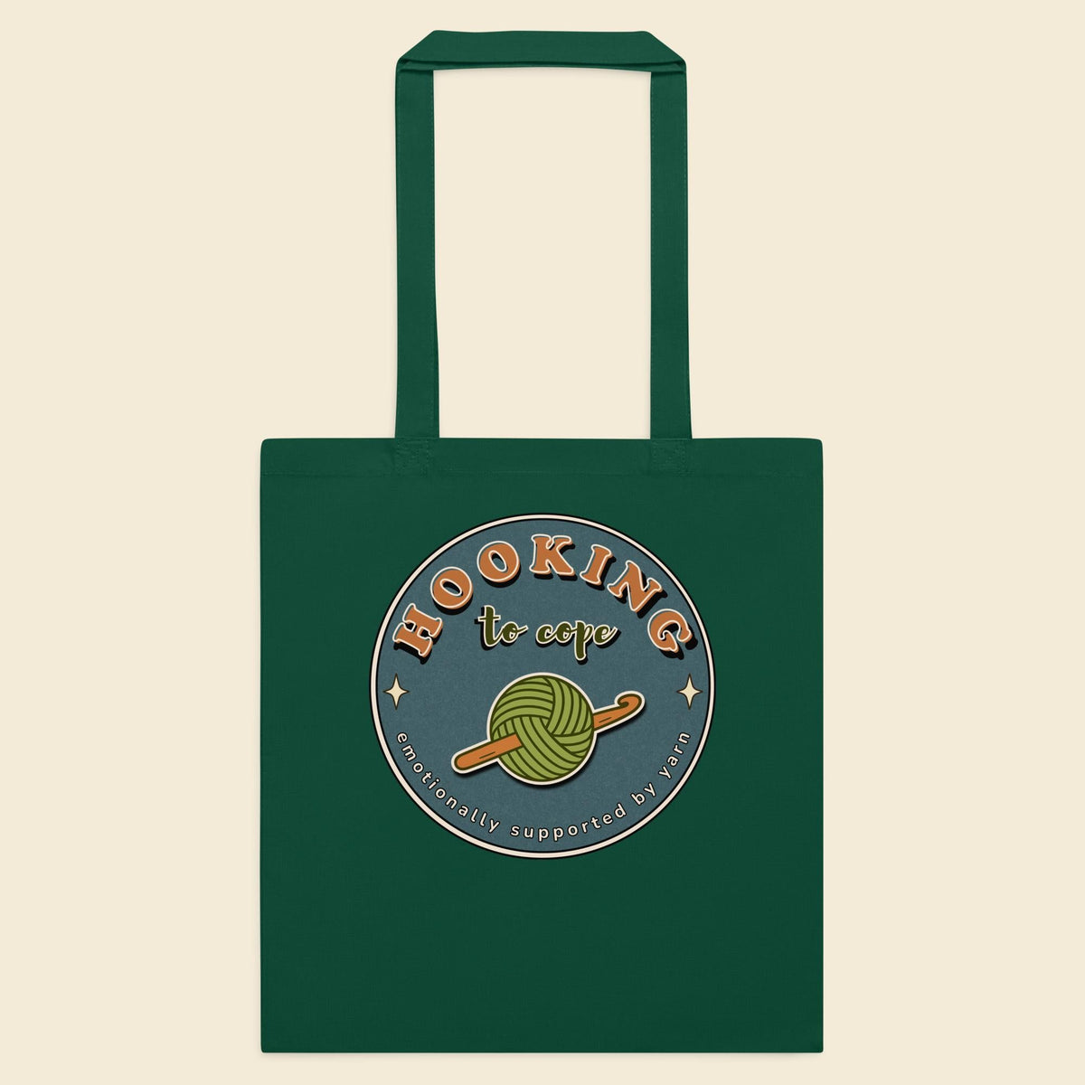 Bottle green cotton tote bag with Hooking to Cope crochet badge artwork