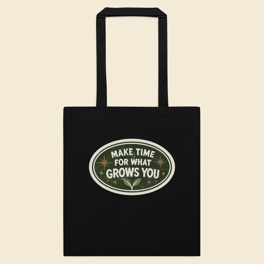 Black cotton tote bag with Make Time for What Grows You artwork