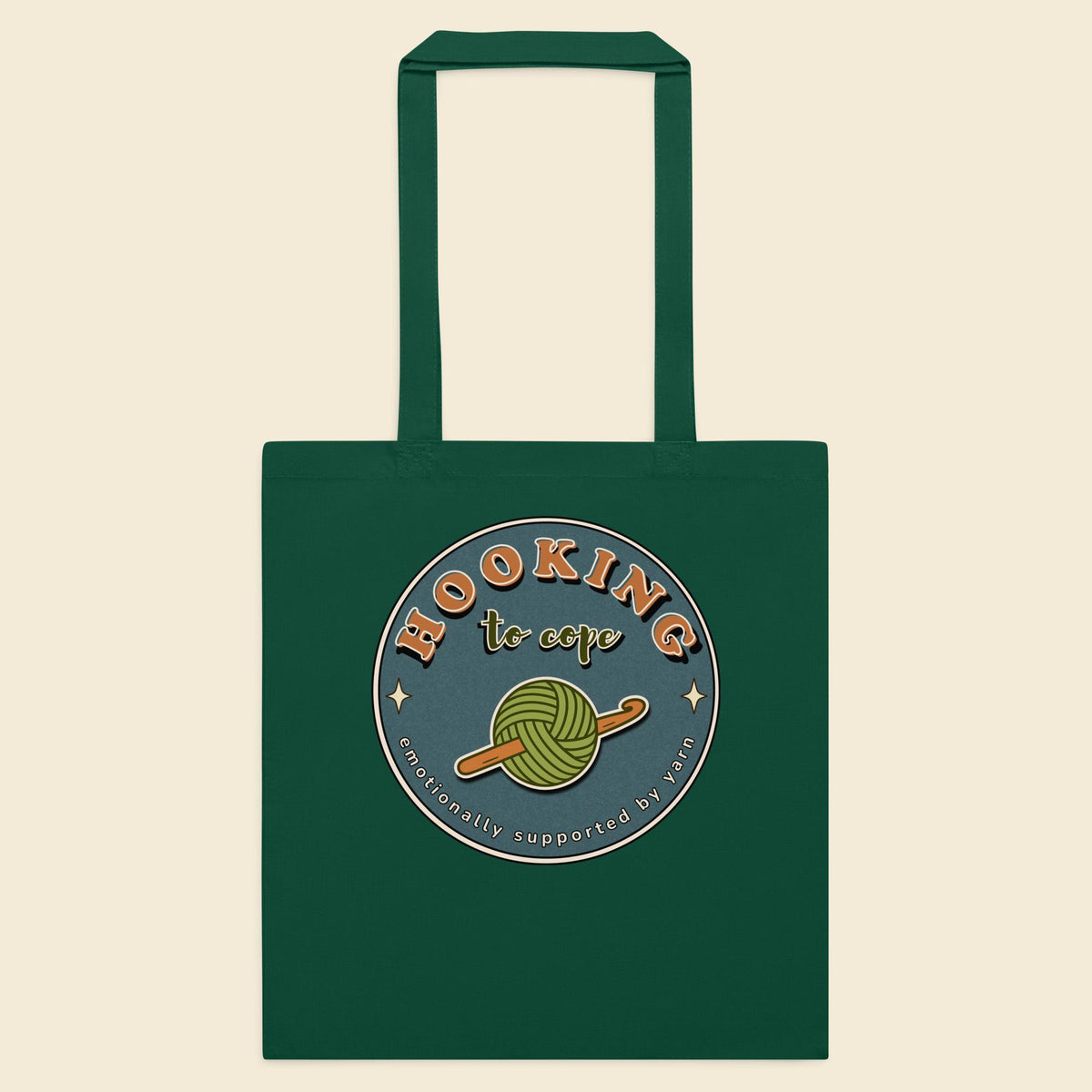 Bottle green cotton tote bag with Hooking to Cope crochet badge artwork