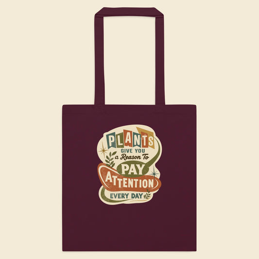 Burgundy cotton tote bag with Plants Give You a Reason artwork