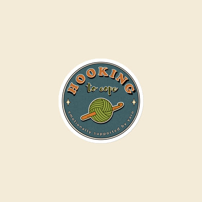 Hooking to Cope round crochet badge magnet with a yarn ball and hook, 3 × 3 in