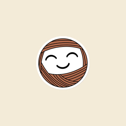 Mellow, a smiling terracotta Yarn Creature magnet, 3 × 3 in, on a cream background