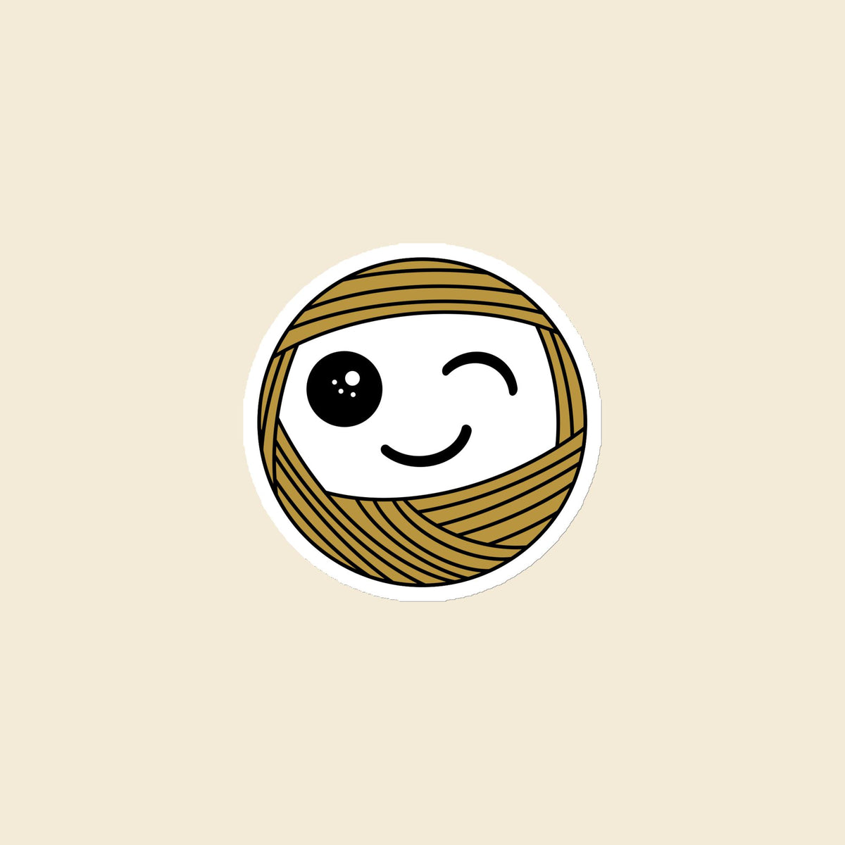 Wink, a winking mustard Yarn Creature magnet, 3 × 3 in, on a cream background