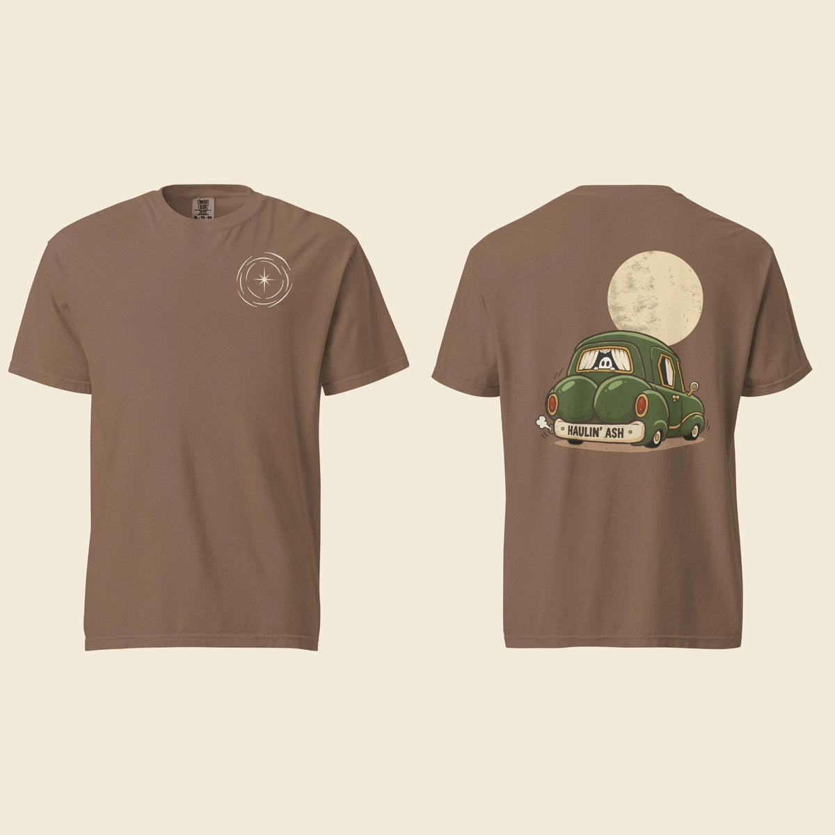 Front and back of an espresso heavyweight T-shirt: a small cream vortex on the chest and Haulin’ Ash artwork of a green car under a full moon on the back