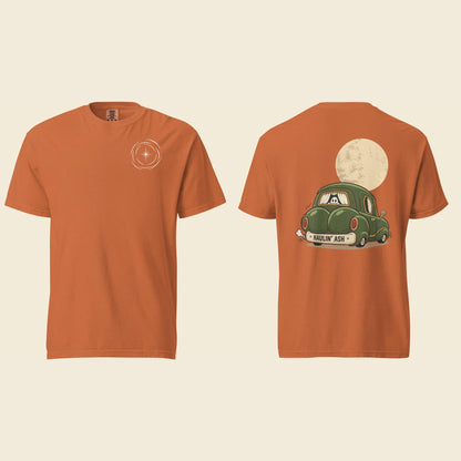Front and back of a yam heavyweight T-shirt: a small cream vortex on the chest and Haulin’ Ash artwork of a green car under a full moon on the back