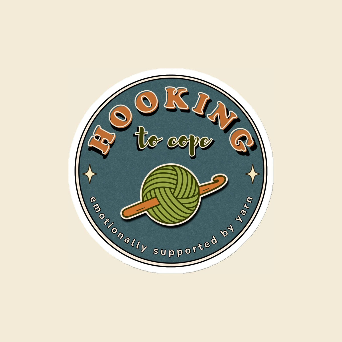 Hooking to Cope round crochet badge magnet with a yarn ball and hook, 4 × 4 in
