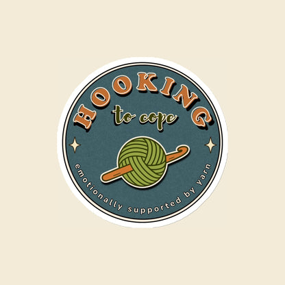 Hooking to Cope round crochet badge magnet with a yarn ball and hook, 4 × 4 in