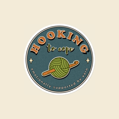 Hooking to Cope round crochet badge sticker with a yarn ball and hook, 4 × 4 in
