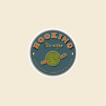 Hooking to Cope round crochet badge sticker with a yarn ball and hook, 3 × 3 in