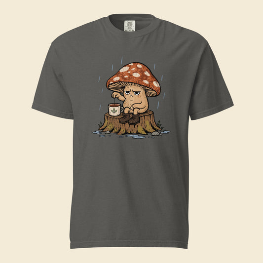 Pepper gray heavyweight T-shirt with Mushroom Tea artwork of a grumpy mushroom drinking tea on a stump in the rain
